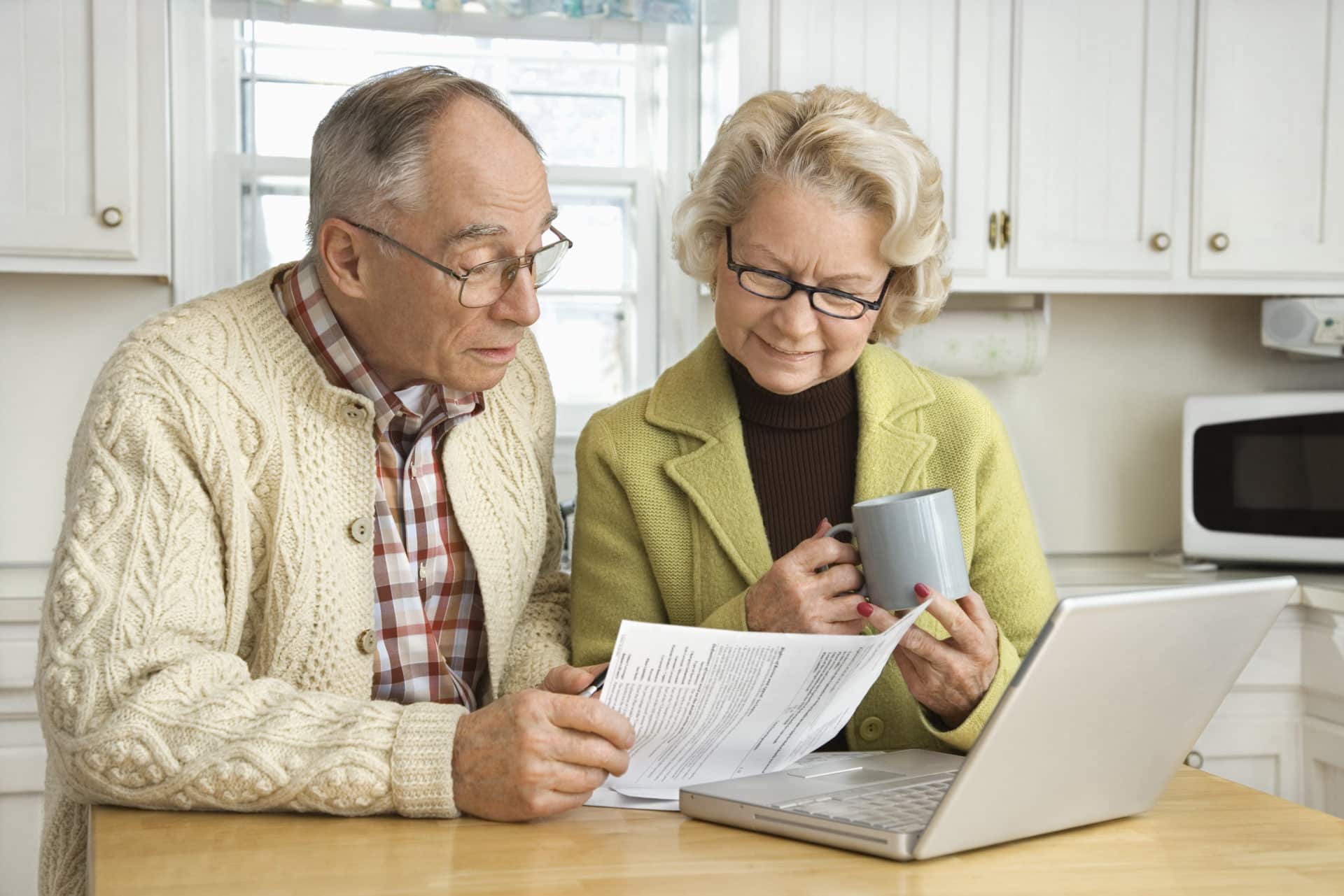 senior couple doing finances protection against financial fraud