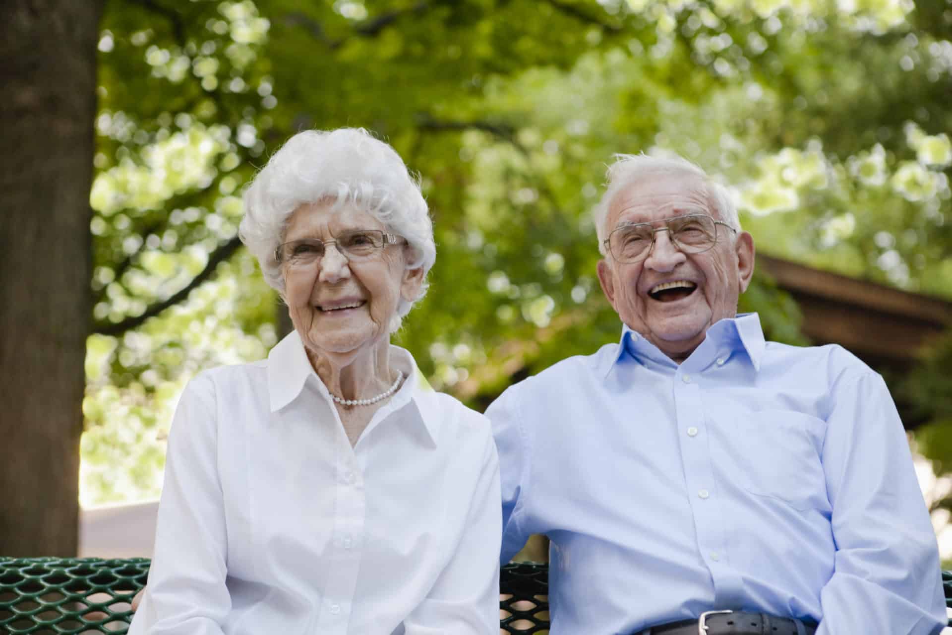 happy senior couple smiling daily money management services for seniors